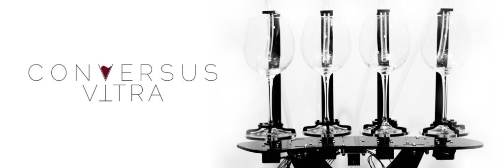 Banner image for the project with 4 clear wine glasses attached to a black metal platform. The text design fills the V of Conversus with Wine