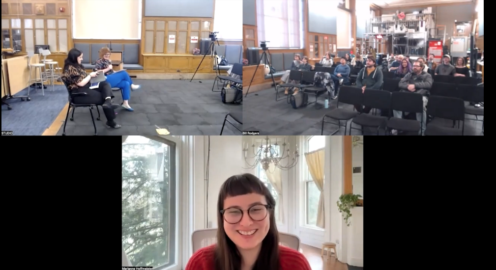 screenshot of three camera angles are combined, top left shows MFA student Inbar Hagai sitting at the front of the room with professor Angela Washko. The second camera angles hows the audience seated in black chairs. The bottom frame shows Marianne Hoffmeister-Castro seated in her house on zoom.